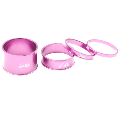 Pink, lightweight aluminium bicycle headset spacer kit with 4 sizes.