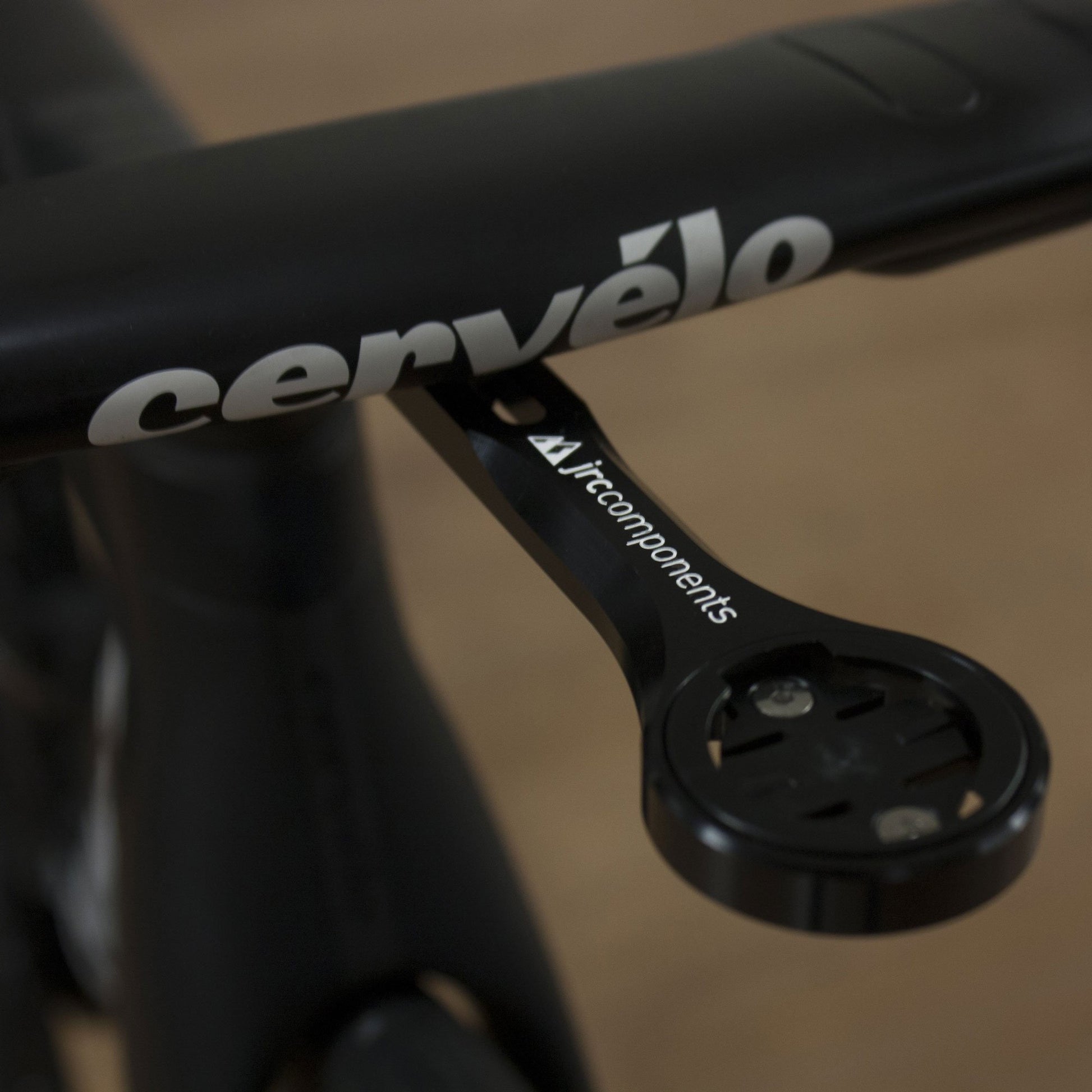 Black, lightweight, aluminium integrated amplitude bicycle handlebar mount, fitted to handlebar, close up view