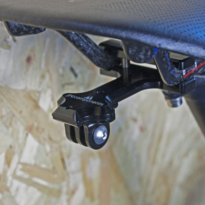 Black saddle rail mount with adaptor piece for rear lights and action cameras, fitted to bicycle
