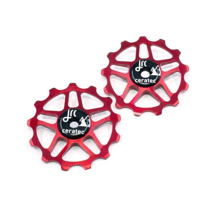 Red, lightweight aluminium pulley wheel set for bicycle, compatible with 13 tooth Shimano 12 speed